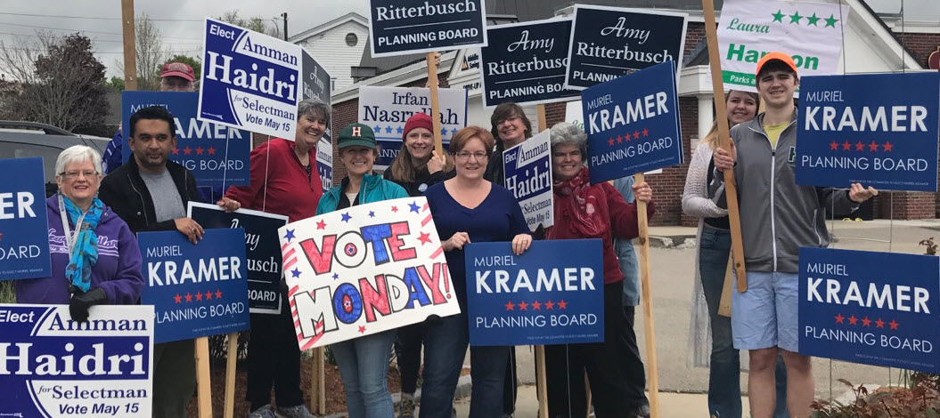 image of people holding campaign signs